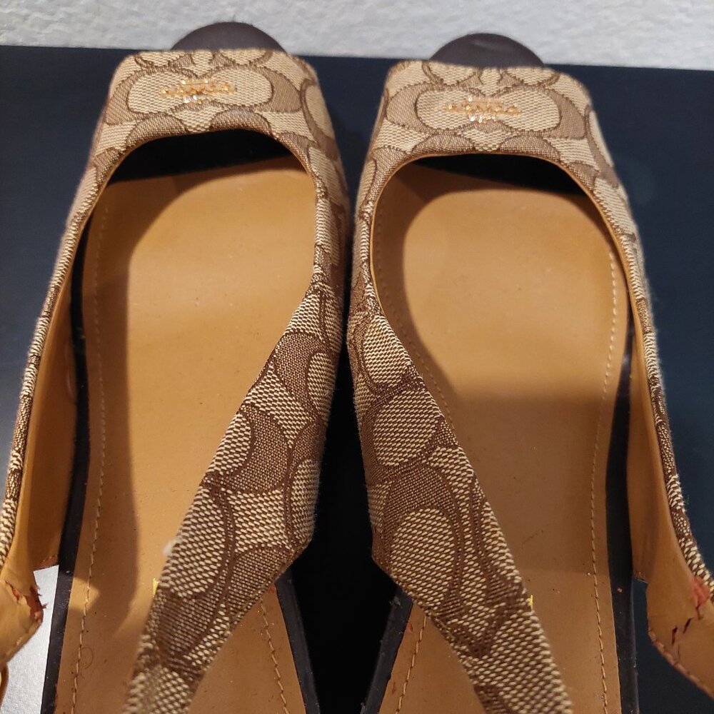 Coach monogram, caramel and brown wedge shoe.